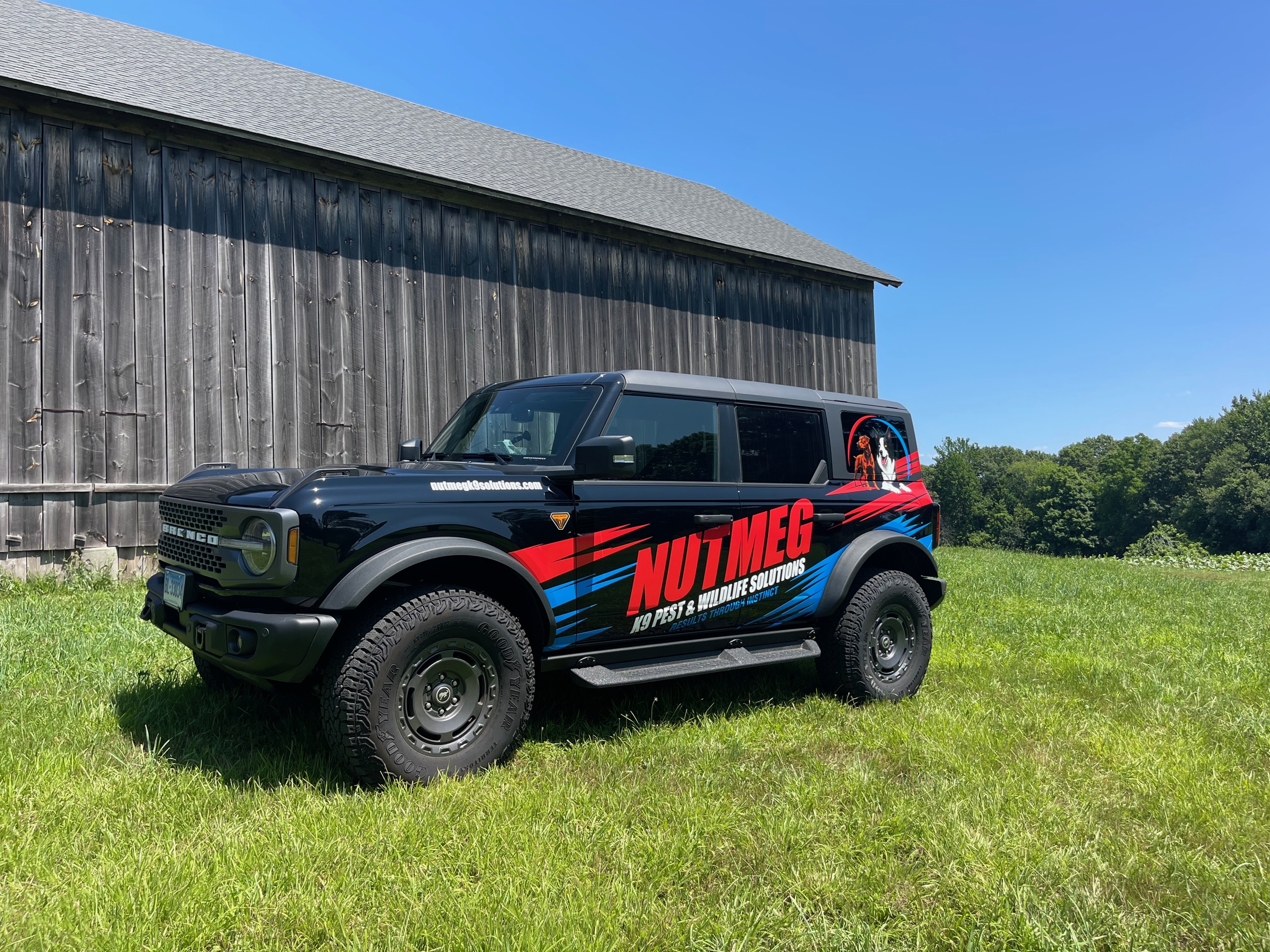 Nutmeg K9 Solutions wrapped Bronco on a professional property site