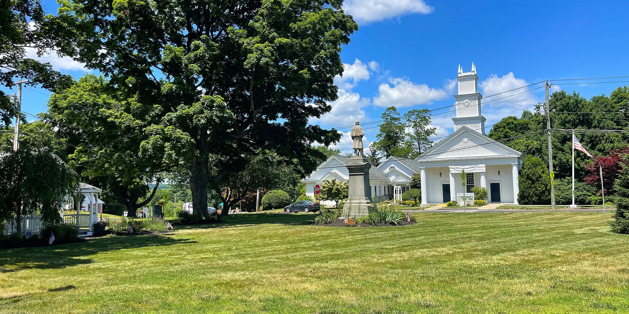 Wolcott Green with the historic church and monument in Wolcott, Connecticut